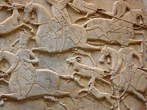 A Persian mid-relief (mezzo-rilievo) from the Qajar era, at Tangeh Savashi in Iran, which might also be described as two stages of low-relief. This is a rock relief carved into a cliff.