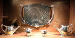 French Art Nouveau Silver Tea and Coffee Service (1900-05) by Paul follot: A five-piece set including a tea pot and a platter. 