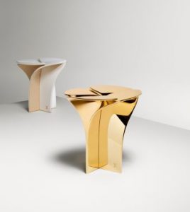 Blossom Stool, available in gold metal and leather/wood.