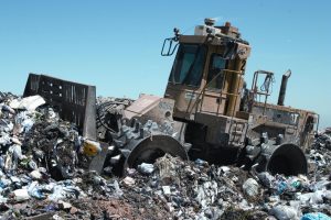 A landfill compaction vehicle in action