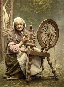 a photo of woman with Irish spinning wheel – around 1900 Library of Congress collection