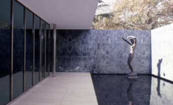 Photo of George Kolbe's statue outside the Barcelona Pavilion: A human sculpture of a person appearing to be dancing. 