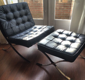 Barcelona chair by Mies and Reich: this version has thick, dark cushions. 