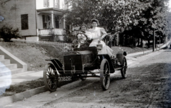 pre 1908 Ford with two girls