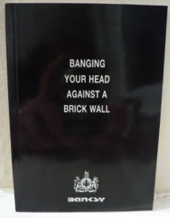 Banksy's Banging Your Head Against a Brick Wall 
