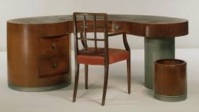 The Cambridge Armchair with the desk designed for the eye surgeon F. A. Williamson-Noble.