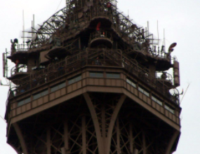 Photo of the top of the Eiffel Tower. 