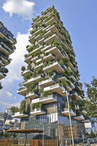 Bosco Verticale (Vertical Forest), Milan, Boeri Studios (2009-2014); sprawling towers meet sprawling greenery.  : A large building with uneven flowers that have various plants growing on these uneven platforms.