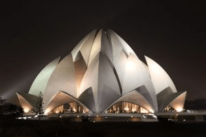 Lotus Temple, 1986, New Delhi; by Fariborz Saba: A big white egg-shaped building with various "crack"-looking designs. 
