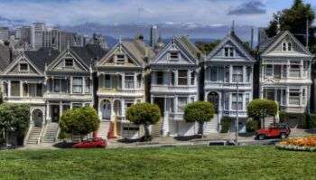 Photo from the 90's sitcom, Full House of the Painted Ladies houses in San Francisco. These ornate houses are in various colors and are in the Victorian Style. 