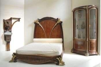 A mahogany bed, known as the Nénuphar bed for its water lily motifs, designed and manufactured by Louis Majorelle around 1902-3, on display at the Musée d'Orsay, Paris.