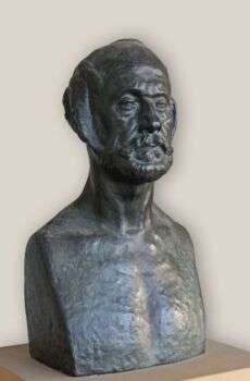 August Perret (Musée Bourdelle, Paris): Un buste de l'architecte dans une pierre sombre.