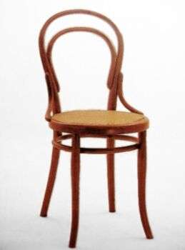 A photo of a Thonet’s chair with thin legs made in a light-colored wood.