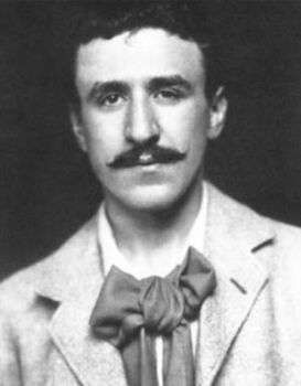 Charles-Rennie-Mackintosh photo in black and white. He is wearing a tie tied in a bow, a light colored jacket and has a dark curly mustache. 