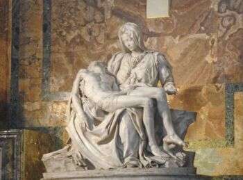 La Pietà by Michelangelo, located in the Vatican: A photo of the statue of the Virgin Mary holding her son after his death. 