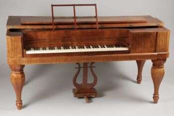 A light wood piano.