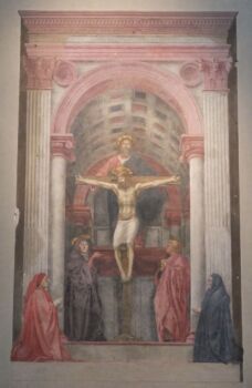 Masaccio’s Holy Trinity. A faded image of a painting of Jesus on the cross. Reds, whites and reds are used in this photo. 