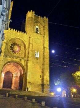 Oldest Lisbon Cathedral at Night, thus there is a bizarre yellow tint to the building. 