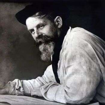 Louis Majorelle photo where he has a long, struffy beard and is wearing a black hat. 