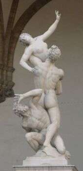 Rape of the Sabine Women sculpture of two men fighting over a distressed woman naked. 