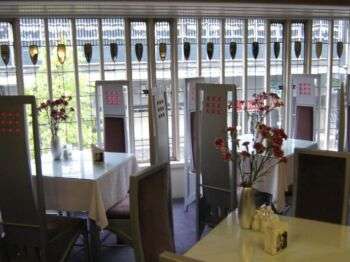 Willow Tearooms, Glasgow: inside furniture with white chairs and tables with white table cloths. 