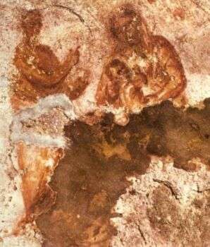 Foto raffigurante i resti di un affresco raffigurante Maria che allatta Gesù, ritrovato nelle Catacombe di Priscilla, Roma. 