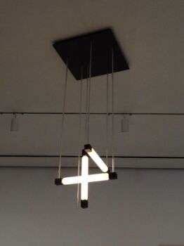 Hanging Lamp (Gerrit Rietveld) - 1920- Museum of Modern Art - Manhattan NY: A cross, and straight bar light fixture that hangs from the ceiling by 6 chords. 